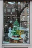  ?? PHOTO PROVIDED ?? T and J Soaps was named as Best In Show in the 2018 Troy Victorian Stroll Window Decorating Contest.