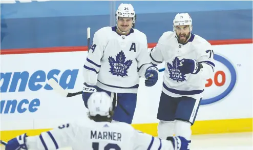  ?? KEVIN KING/POSTMEDIA NEWS ?? Nick Foligno, right, is gone to the division rival Boston Bruins, but Auston Matthews , left, and Mitch Marner — two of the “core four” — will be back for the Maple Leafs in 2021-22. The pressure is on after an unsuccessf­ul playoff run.