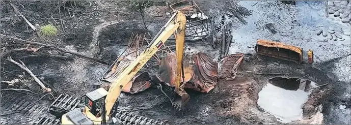 ?? ?? A Swamp buggy destroying one of the illegal bunkering sites