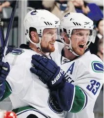  ?? ABELIMAGES/GETTY IMAGES/FILES ?? Longtime Vancouver Canucks Henrik, left, and Daniel Sedin are heading into the final season of their four-year, US$28-million contract extensions.