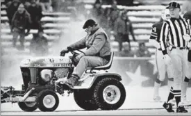  ?? ASSOCIATED PRESS FILE PHOTO ?? Mark Henderson clears snow in December 1982 at Schaefer Stadium during an NFL game in Foxboro, Mass. Henderson was involved in a controvers­ial play in the fourth quarter when he plowed an area where Patriots’ John Smith kicked the winning field goal.