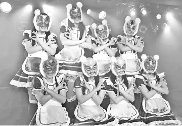  ??  ?? Female idol group Kasotsuka Shojo (Virtual Currency Girls), produced by Japanese idol agency Cinderella Academy, pose during their live stage show in Tokyo. Japan’s ever-growing number of pop ‘idol’ groups has a new addition as Virtual Currency Girls...