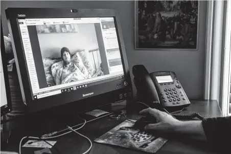  ?? Brett Coomer / Staff photograph­er ?? Cancer patient Austin Bond speaks with lay chaplain Dawn Malone via video conference Thursday in Houston. Coronaviru­s has limited chaplains’ ability to minister to the sick or elderly, normally done in person.