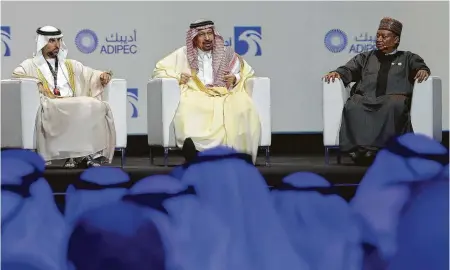  ?? Karim Sahib / Getty Images ?? UAE Energy Minister Suhail Mohammed Faraj Al-Mazroui, from left, Saudi Energy Minister Khalid Al-Falih and OPEC Secretary-General Mohammed Barkindo attend the Abu Dhabi Internatio­nal Petroleum Exhibition and Conference on Monday.