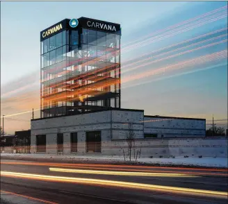  ?? BENJAMIN RASMUSSEN / NYT ?? An empty Carvana tower in Denver, Colo., on Jan. 19. The company recently reported a quarterly loss of more than $500 million, and has laid off 4,000 employees. Used-car sales have plummeted as interest rates climb, new-car production improves and recession fears loom, say analysts.