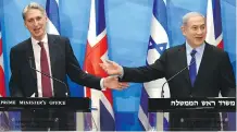  ?? DEBBIE HILL/ AFP/ GETTY IMAGES ?? British Foreign Secretary Philip Hammond, left, holds a spirited news conference with Israeli Prime Minister Benjamin Netanyahu in Jerusalem on Thursday.