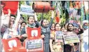  ?? —ANI ?? Indian Youth Congress supporters shout slogans during a protest against the hike in fuel price outside the Textiles Minister Smriti Irani’s house in New Delhi on Saturday.