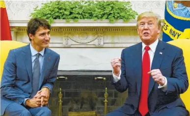  ?? THE ASSOCIATED PRESS ?? Canadian Prime Minister Justin Trudeau meets with U.S. President Donald Trump in the Oval Office of the White House in Washington, D.C., on Wednesday.