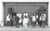  ?? KRISTEN ZEIS/STAFF ?? People stand in line outside a federally run COVID-19 vaccinatio­n clinic at Military Circle in Norfolk on March 31.