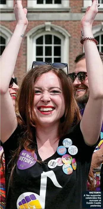  ??  ?? victory: A Yes supporter celebrates the success at Dublin Castle yesterday