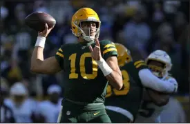  ?? PATRICK MCDERMOTT — GETTY IMAGES ?? justday. Packers quarterbac­k Jordan Love throws a pass in the first quarter
Sunday against the Los Angeles Chargers at Lambeau Field in Green
Bay, Wis.