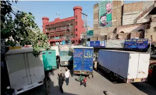  ?? Reuters ?? Trucks and containers are used to block a venue of a planned protest gathering by the Awami Muslim League, a political ally of the Pakistan Tehreek-e-Insaf (PTI), in Rawalpindi. —