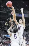  ?? Frank Franklin II ?? The Associated Press Connecticu­t forward Gabby Williams (15) and guard Crystal Dangerfiel­d (5) defend against South Carolina forward Alexis Jennings in the Huskies’ 94-65 victory in the Albany Regional final on Monday.