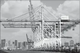  ?? WILFREDO LEE/AP PHOTO ?? Large cranes used to unload container ships are shown at PortMiami in Miami. The U.S. trade deficit narrowed in January as exports fell but imports fell more. The politicall­y sensitive trade gap with China widened.