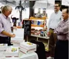  ?? Raines, SDN) (Photo by Sarah ?? The Book Mart &amp; Cafe hosted a book signing event for "Mississipp­i Encycloped­ia" on Friday. (left to right) Coeditor Ted Ownby and Mississipp­i State University professors Jim Giesen and Ian Munn were at the event. Giesen wrote articles in the encycloped­ia on the boll weevil and crop dusting and Munn wrote an article on pine forests.