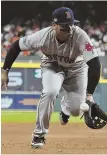  ?? STAFF PHOTO BY CHRISTOPHE­R EVANS ?? SOMETHING MISSING: Rafael Devers fails to come up with a grounder off the bat of the Astros’ Alex Bregman during the Red Sox’ 8-2 victory in Game 3.