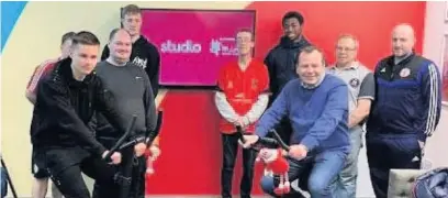  ??  ?? Paul Kendrick (front right) CEO of Studio gets active for Red January with Accrington Stanley football stars