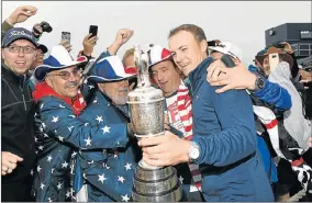  ?? Picture: GETTY IMAGES ?? MAJOR CELEBRATIO­N: Jordan Spieth of the United States holds the Claret Jug as he is congratula­ted by fans after winning the 146th Open Championsh­ip at Royal Birkdale on Sunday in Southport, England