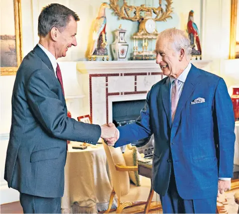  ?? ?? Jeremy Hunt meets the King in Buckingham Palace ahead of his tax-cutting Budget today, which the Chancellor claims will boost growth and give more money to families