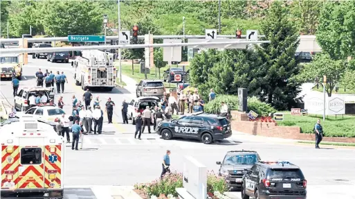  ?? JOSHUA MCKERROW/TRIBUNE NEWS SERVICES ?? Police respond to a shooting reported at Capital Gazette newspaper in Annapolis, Md., on Thursday. The shooting was later deemed a “targeted attack.”