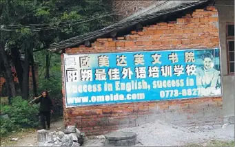  ?? JIM O'NEILL / FOR CHINA DAILY ?? The billboard reading “Success in English, success in life”, seen by Jim O'Neill at a village near Yangshuo, Guangxi Zhuang autonomous region, left a strong impression on the British economist.