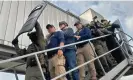  ?? In this handout photo, Mancuso, third from left, arrives in Colombia. Photograph: Colombian police/EPA ??