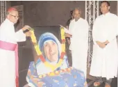 ?? —DC ?? Archbishop Rt. Rev. Thumma Bala garlands a potrait of Saint Mother Teresa on her 20th death anniversar­y in Hyderabad on Friday.