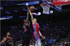  ?? MATT SLOCUM — THE ASSOCIATED PRESS ?? Sixers’ backup guard Danny Green, right, strikes a blow for NBA senior citizens with this dunk past Toronto’s Pascal Siakam during Game 2Monday night at Wells Fargo Center.