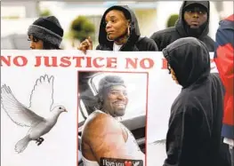  ?? Gary Coronado Los Angeles Times ?? RICKIESHA BRANCH, center, attends a Jan. 30 news conference regarding her late boyfriend, Anthony Lowe, who was killed by Huntington Park police officers.