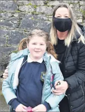 ??  ?? Pupil Lily O’Grady pictured with her mother, Cora, looking forward to her return to school earlier this week at Bunscoil na Toirbhirte, Mitchelsto­wn.