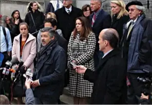  ?? Associated Press ?? Ian Hockley, front left, father of Dylan Hockley, one of the children killed in the 2012 Sandy Hook Elementary School shooting, speaks Tuesday outside the Connecticu­t Supreme Court in Hartford following an appeal hearing on whether gunmaker Remington...