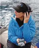  ?? Conservati­on Internatio­nal ?? Olive Andrews records whale songs, which, in most cases, vary between breeding grounds.