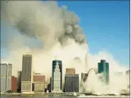  ?? Kathy Willens / AP ?? A view of the Manhattan skyline from Brooklyn, Tuesday, Sept. 11, 2001, after the World Trade Center towers collapsed.