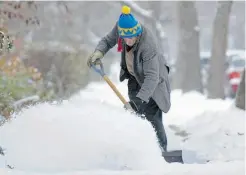  ?? ED KAISER/ EDMONTON JOURNAL ?? Ed Church shovels Thursday along 84th Avenue near 106th Street.