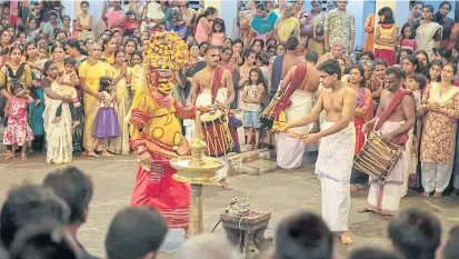  ??  ?? LEFT
A Theyyam Mutthapan performanc­e at Parassinik­avadu, a riverside temple between Payyanur and Kannur in North Kerala.