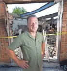  ??  ?? “Love is going to go a long way,” says Scott Carpenter, standing in what remains of B&L Office Furniture.