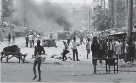  ??  ?? Police fire tear gas at supporters of Odinga who claimed ‘massive’ fraud in Kenya’s presidenti­al elections. Al Jazeera