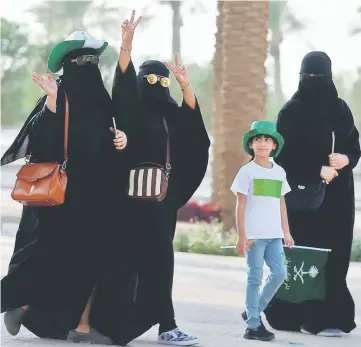  ??  ?? Saudi Arabian women arrive at a rally to celebrate the 87th annual National Day of Saudi Arabia in Riyadh. — Reuters photo