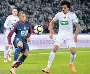  ?? Picture: GETTY IMAGES ?? FIRMLY IN CHARGE: Kylian Mbappe of Paris Saint-Germain controls the ball as he is challenged by an Olympique de Marseille defender last week. Mbappe will lead PSG into battle against Real tonight