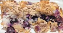  ?? Contribute­d ?? Warm baked blueberry and pecan cobbler with the added flavor of banana and coconut.