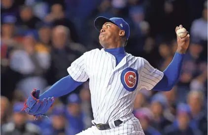  ?? DENNIS WIERZBICKI, USA TODAY SPORTS ?? Cubs closer Aroldis Chapman delivers a pitch during the seventh inning of the Cubs’ 3-2 victory in Game 5 of the World Series on Sunday at Wrigley Field. Chapman struck out four in 22⁄ innings for an eight-out save. 3