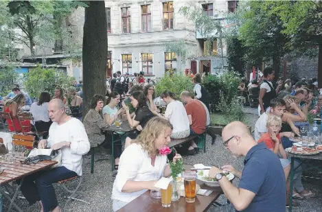  ?? RICK STEVES ?? An economical beer-garden meal in Berlin will put you elbow to elbow with locals and for many, that’s a better experience.