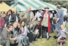  ?? ?? Former town crier Alan Booth chats with visitors at the event in 2013.