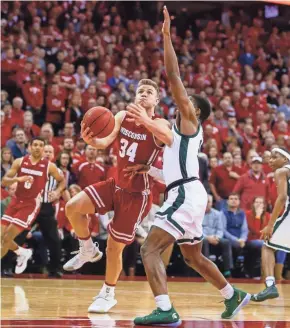  ?? AP ?? Wisconsin guard Brad Davison has been playing with a heavy heart.