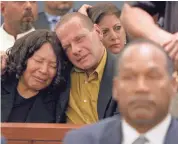  ?? DANIEL GLUSKOTER, AP ?? Tom Scotto and O.J. Simpson’s sister, Carmelita Durio, react at Simpson’s 2008 verdict. Durio died in 2009.