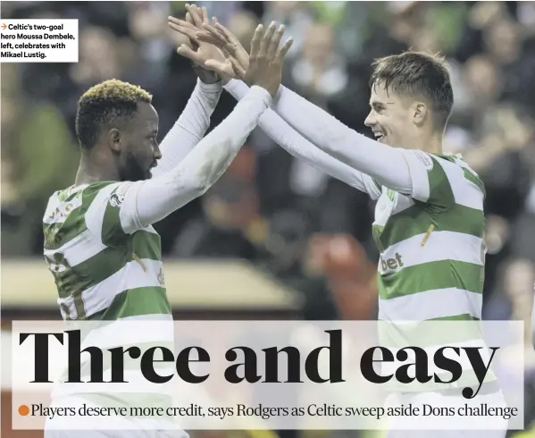  ??  ?? 3 Celtic’s two- goal hero Moussa Dembele, left, celebrates with Mikael Lustig.