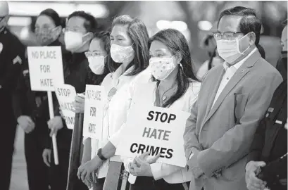  ?? MARCIO JOSE SANCHEZ AP ?? Demonstrat­ors holds signs during a news conference calling to a halt on violence against Asian Americans in Los Angeles.