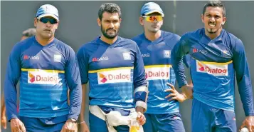  ??  ?? Chamara Kapugedera, Sri Lanka’s stand-in captain (second from left), with bowling coach Chaminda Vaas (left), Dushmantha Chameera and Vishwa Fernando (right) at a practice session in Pallekele.