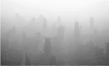 ??  ?? File photo from March 28, 2016 file photo shows the skyline of Shanghai on a polluted day. — Reuters photo