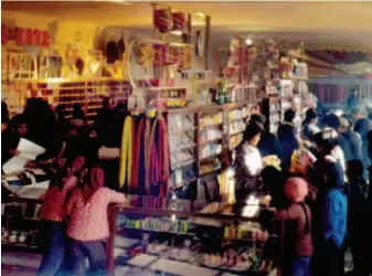  ??  ?? A grocery store in a Beijing village decades ago. Back then, to meet villagers’ demand for daily commoditie­s, many supply and marketing cooperativ­es were set up on the outskirts of Beijing. CFB